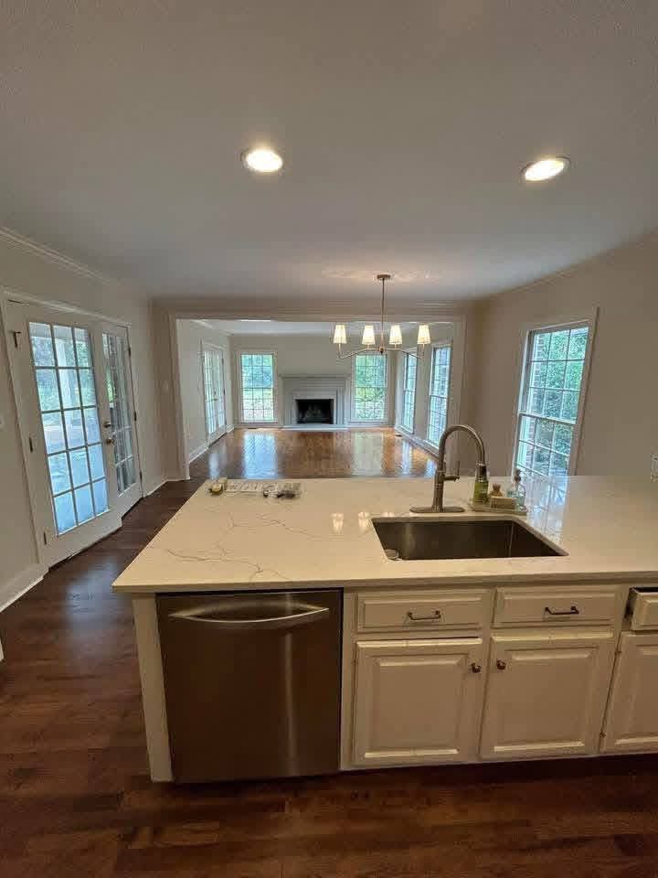 Kitchen island looking through an archway into the living room