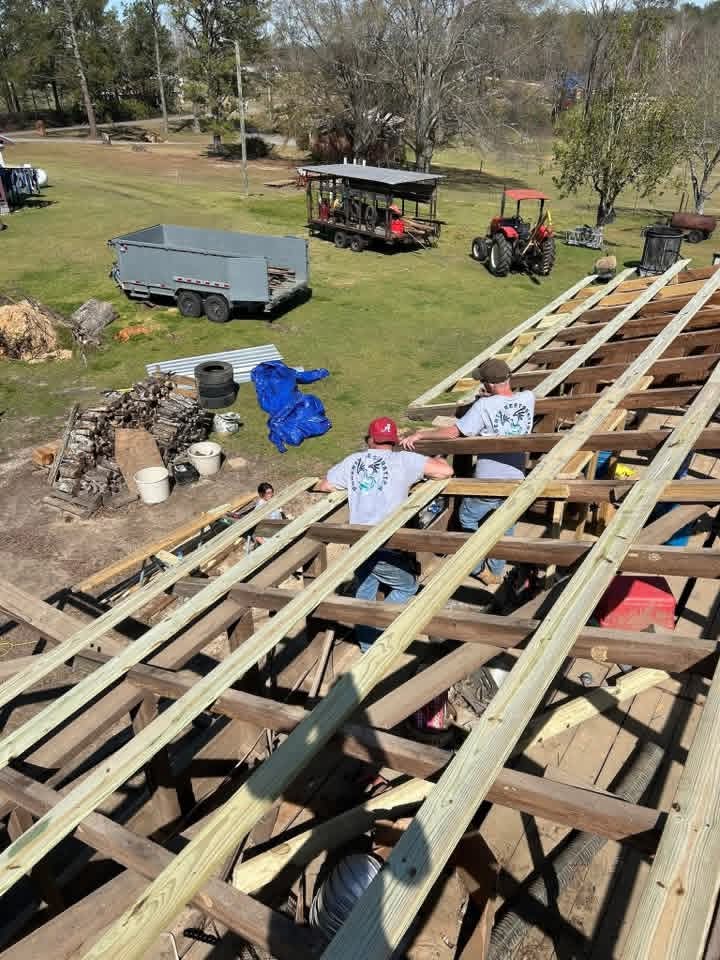 Roofing crew working on roof lath