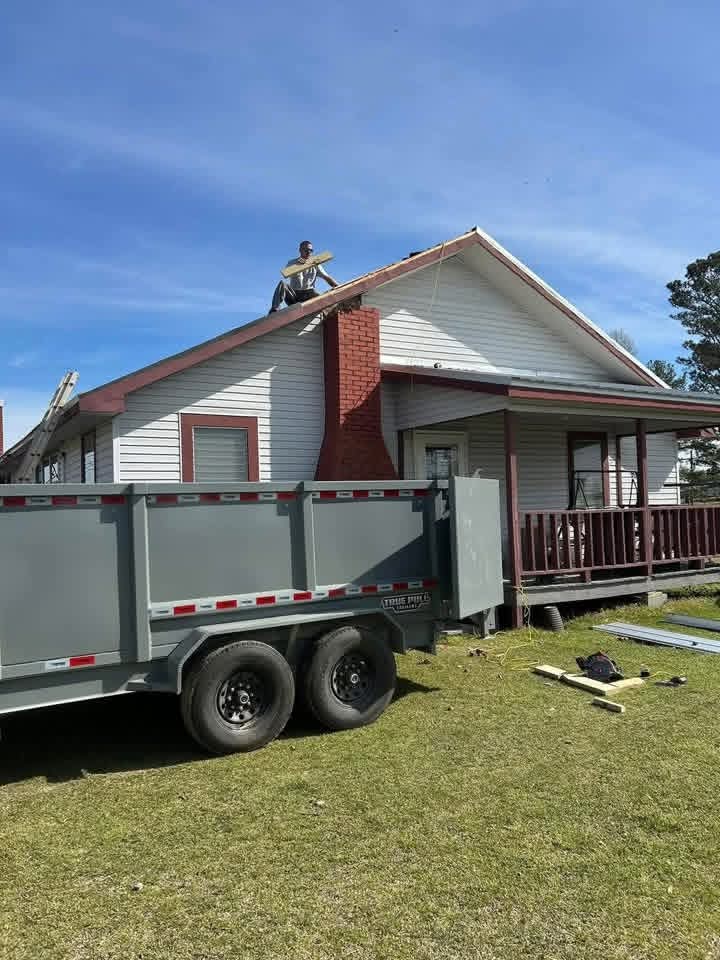 Roof work in progress at a roof peak